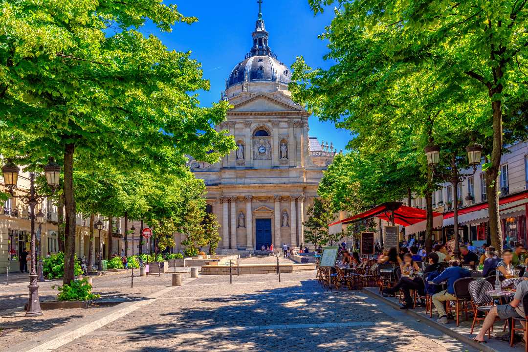 Sorbonne in Paris with the cafes in the square in front